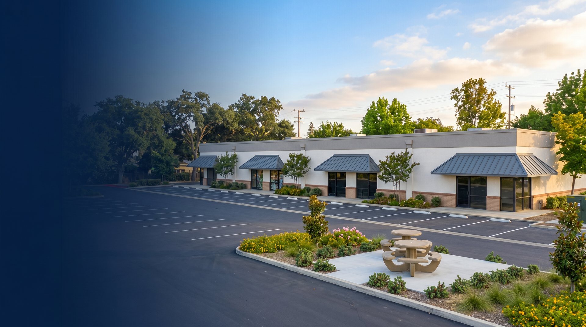 A commercial retail and office building with parking in the Kentuckiana region at golden hour